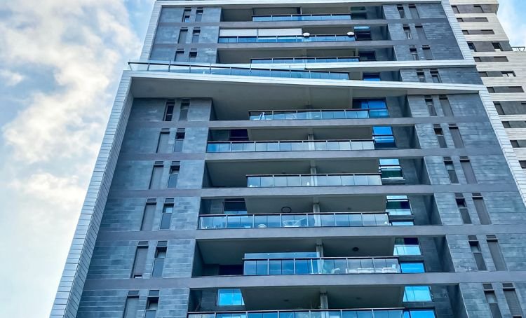 A modern multi-story multifamily high rise building - ECF