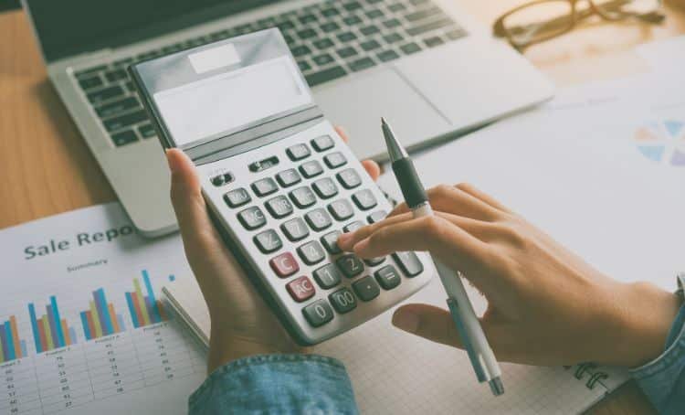 A property investor calculating their DSCR loan - Express Capital Financing