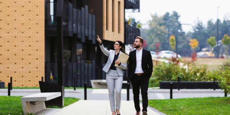 A property manager showing properties to her investor client - Express Capital Financing