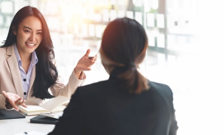A property investor talking with a lender - Financing a New Home Build - ECF
