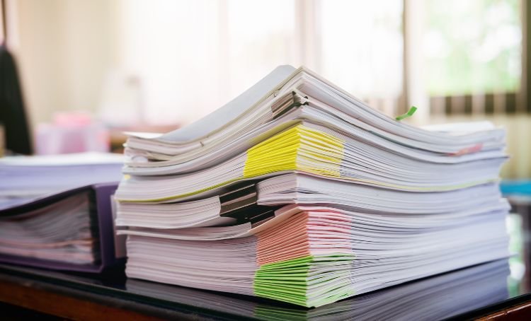 A pile of paperwork for a full doc loan - Express Capital Financing