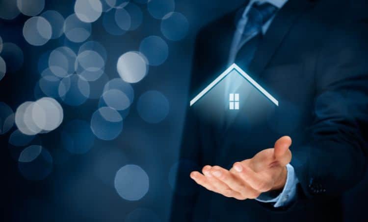 A man holding a digital projection of a property roof - Full Doc Loans with Express Capital Financing