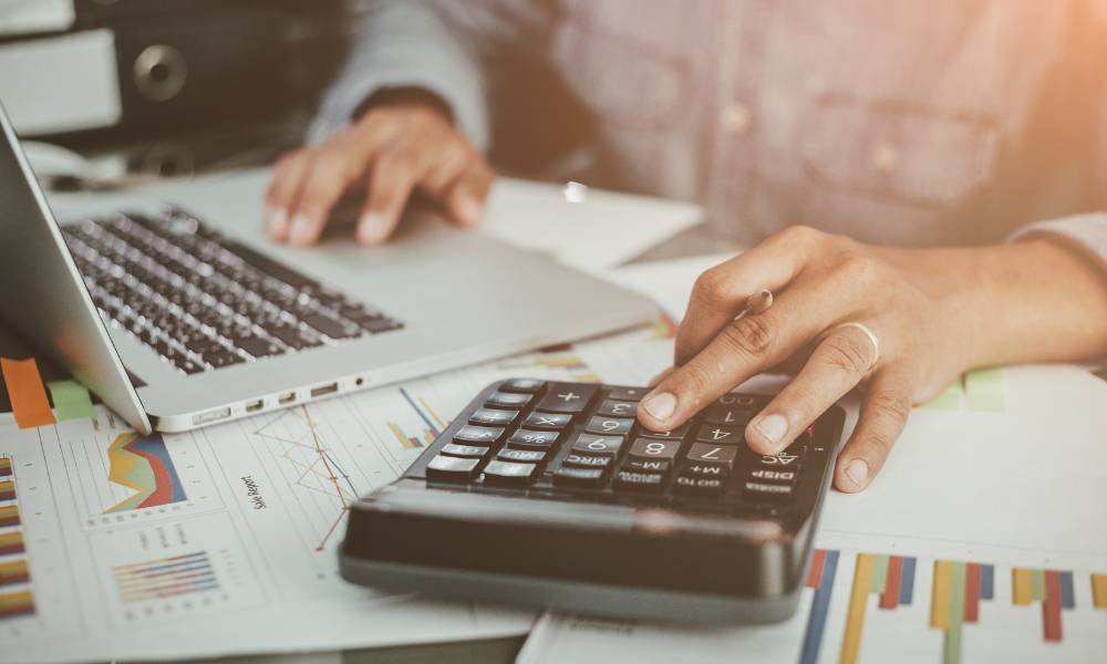 An investor managing their finances for their rental investments - ECF