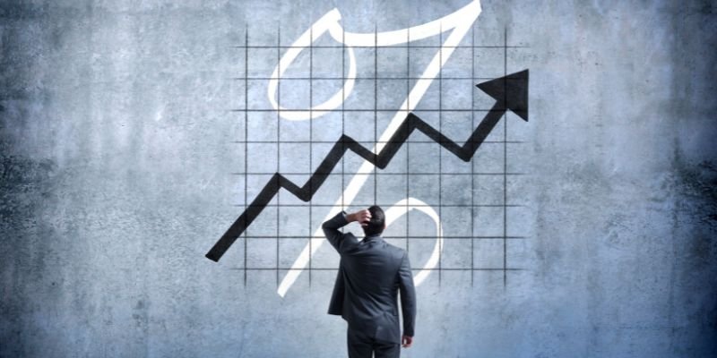 A man staring at a rising graph - ECF