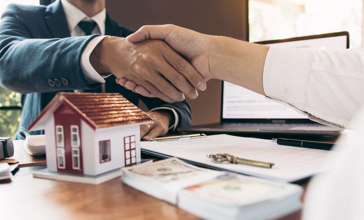 Property investors shaking hands  - Volatility of market rates - Express Capital Financing