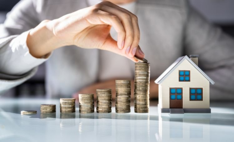 several stacks of coins - buy and hold real estate