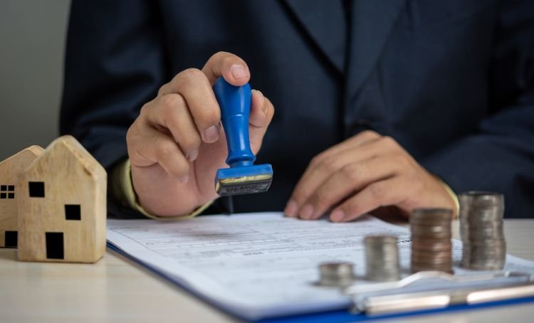 a contract being stamped - fix and flip property